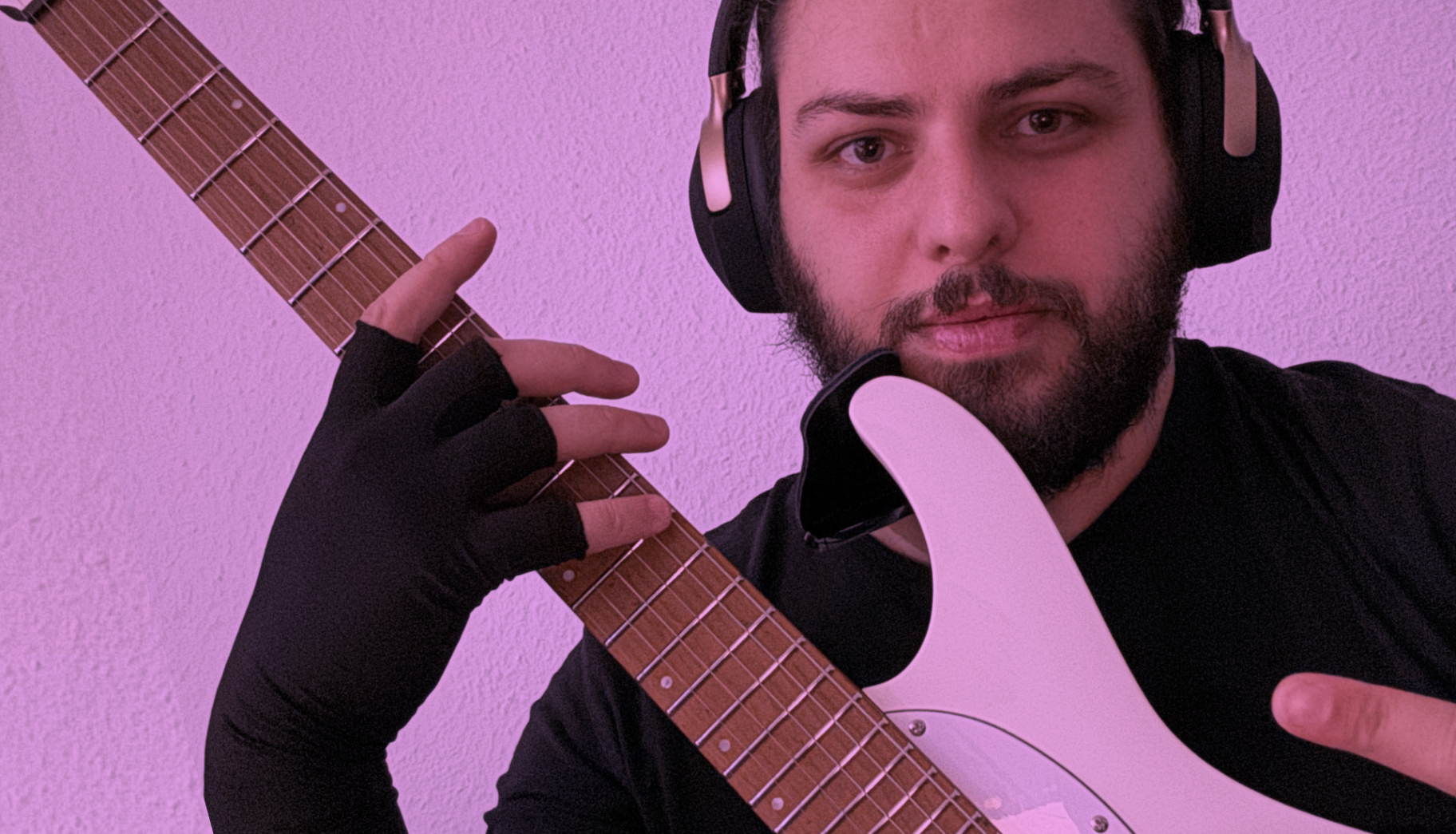 Portrait of Givi Gamkrelidze playing electric guitar with headphones — a personal learning log